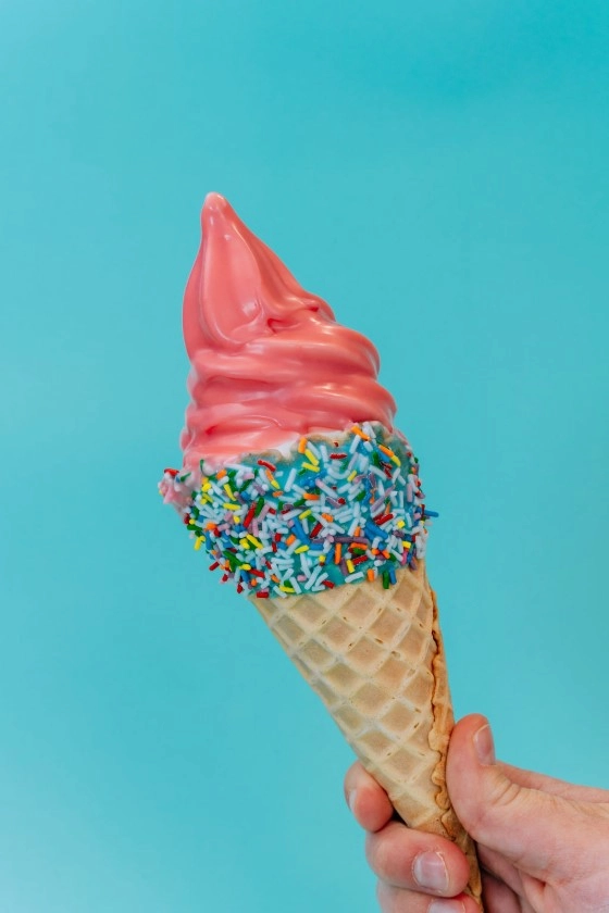 La Diperie ice cream cone with vibrant toppings.