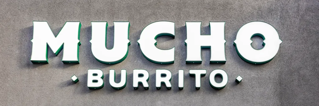 Mucho Burrito outdoor signage showcasing the brand's bold and vibrant identity.